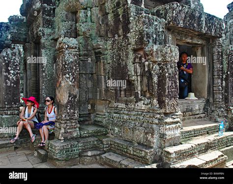 Tourist Taking Photographs In Cambodian Temples Around Angkor Wat Stock