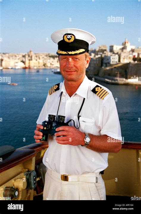Ships Captain standing on the bridge wing, Mediterranean Sea, Malta