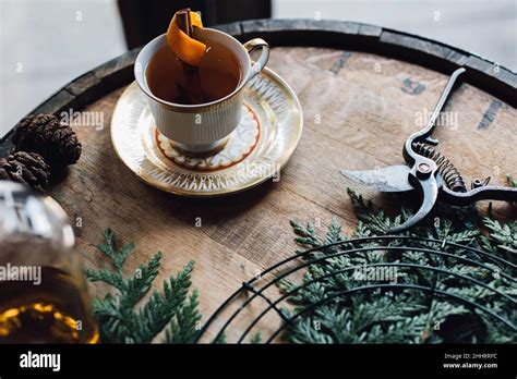 Hot Toddy With Orange In Teacup On Whiskey Barrel Stock Photo Alamy