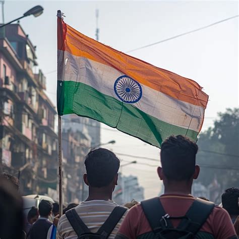 A Man In A Red Shirt Is Holding A Flag That Says Quot India Quot