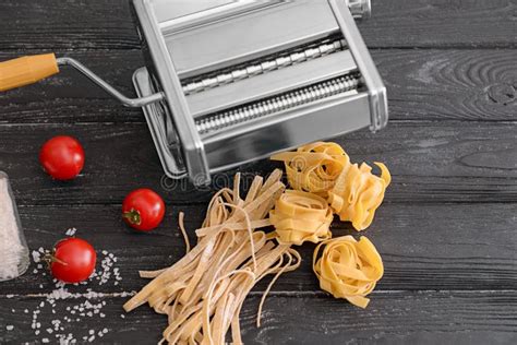 Composition with Homemade Noodles and Pasta Machine on Table Stock ...