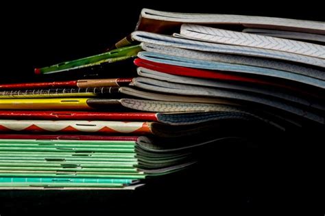 Premium Photo Close Up Of Stack Of Notebooks