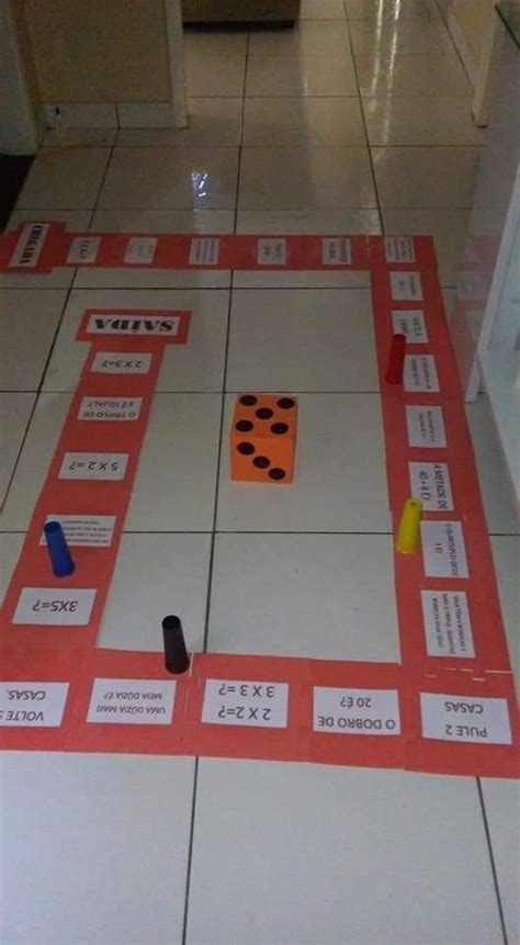 A Board Game With Dices And Numbers On The Floor