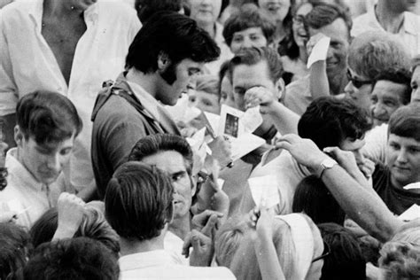 Vintage Photographs Of Elvis Presley Signing Autographs To His Fans