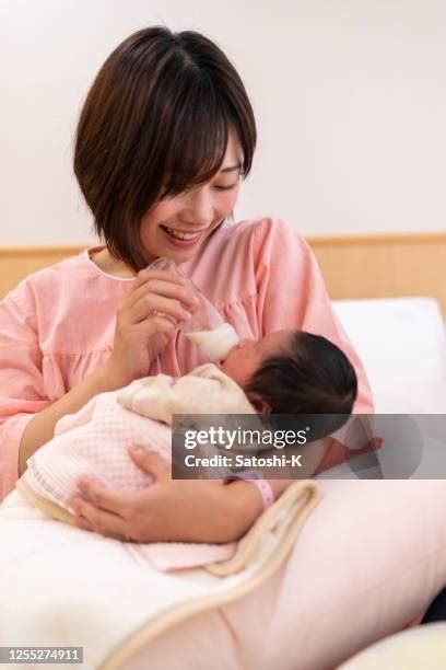 Mom Giving Milk Photos And Premium High Res Pictures Getty Images