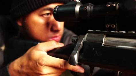 A police with a sniper rifle aims at the... | Stock Video | Pond5