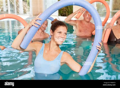 Group Of Seniors In Rehab Doing Hydrotherapy And Water Aerobics Stock