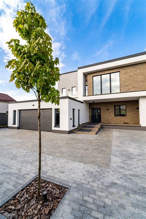 Modern Luxury House with Garage. Blue Sky Above. Nobody in the Yard ...