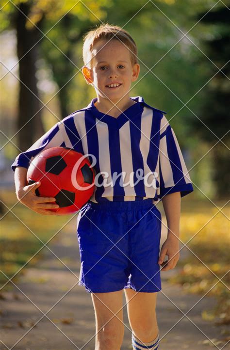 Young Boy Wearing Soccer Uniform - Photos by Canva