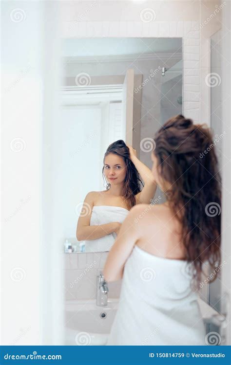 Hair And Body Care Woman Touching Wet Hair And Smiling While Looking