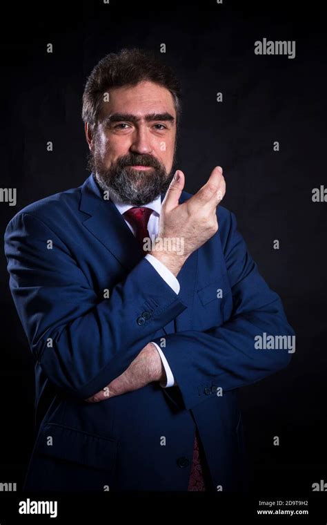 Mature Businessman Dressed In Blue Suit With Red Tie Studio Portrait Stock Photo Alamy