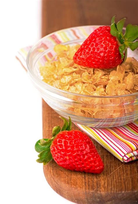 Yogurt Bowl With Fresh Sliced Strawberries And Dry Corn Flakes