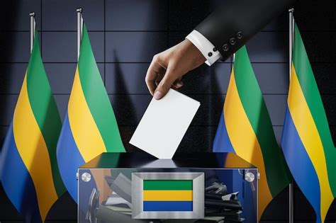 Premium Photo Gabon Flags Hand Dropping Ballot Card Into A Box Voting