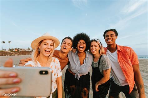 Group Of Diverse Friends Taking A Selfie At The Beach Premium Image