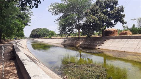 An Irrigation canal in village part of India Stock Photo | Adobe Stock