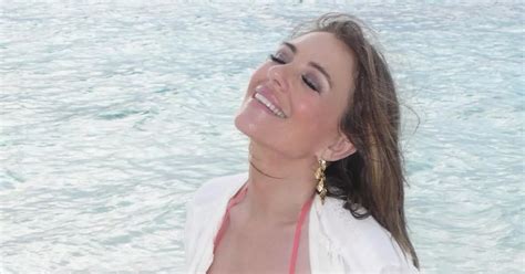 Liz Hurley 58 Strips Down To Plunging Coral Bikini As She Frolics On The Beach Daily Star