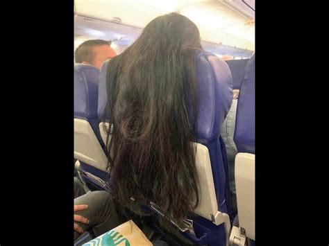 Photo Of Woman S Hair Dangling Over Passenger S Tray Table On Flight Goes Viral Trending