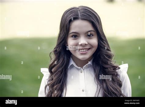 Happy Cute Kid Smile In School Uniform Wearing Long Wavy Brunette Hair