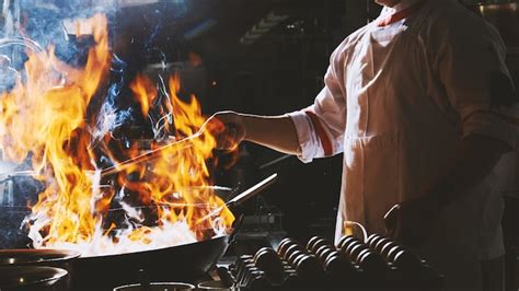 Premium Photo | Chef stir fry in wok