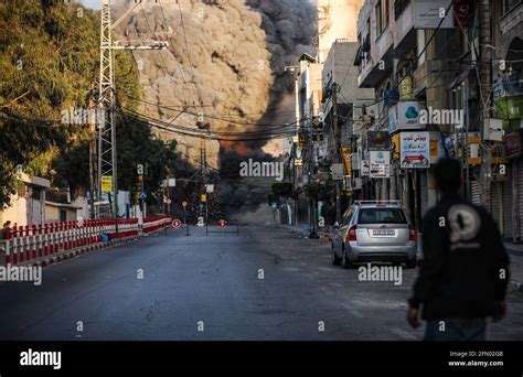 Gaza, Palestine. 12th May, 2021. A missile lands on a tower building ...