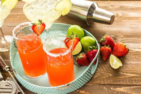 Premium Photo Classic Lime And Strawberry Margaritas On The Rocks