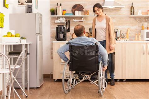Disabled Man Looking at Smiling Wife Stock Image - Image of help ... 