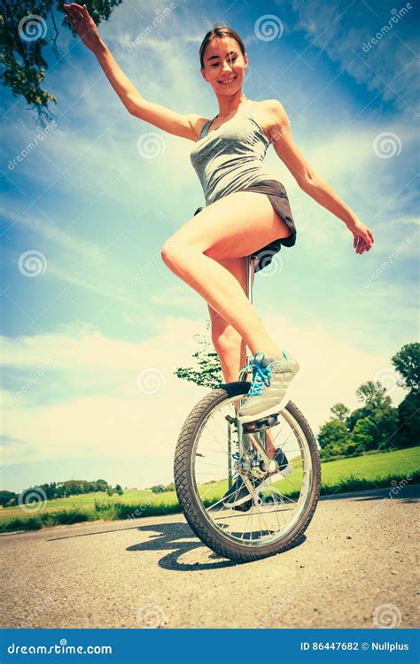 Young Woman Riding Her Unicycle Stock Photo Image Of Sports Riding