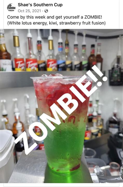 A Green And Red Drink Sitting On Top Of A Counter