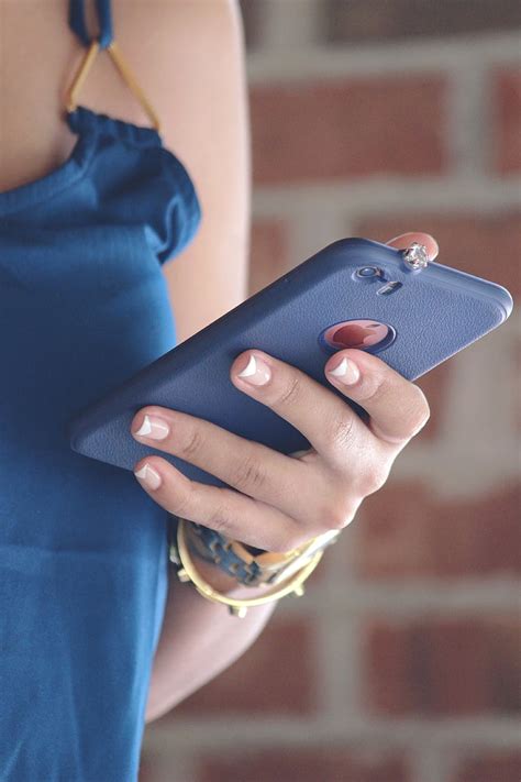 Royalty Free Photo Woman Holding Iphone With Blue Case Pickpik