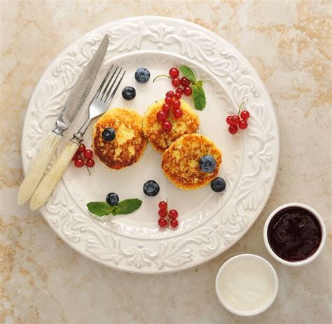 Premium Photo Cheesecakes With Cottage Cheese On A Plate With Sour