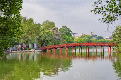 Hanoi, Vietnam - 26 June 2024 Red The Huc Bridge and Ngoc Son Temple in