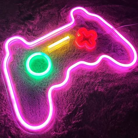 A Neon Video Game Controller Laying On Top Of A Rug