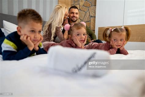 Happy Children And Their Parents High-Res Stock Photo - Getty Images