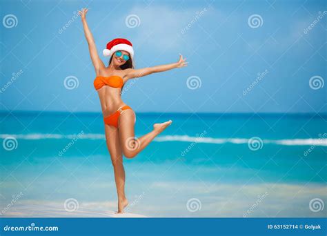 Maiden In Orange Bikini And Hat Of Santa Claus Stock Photo Image Of