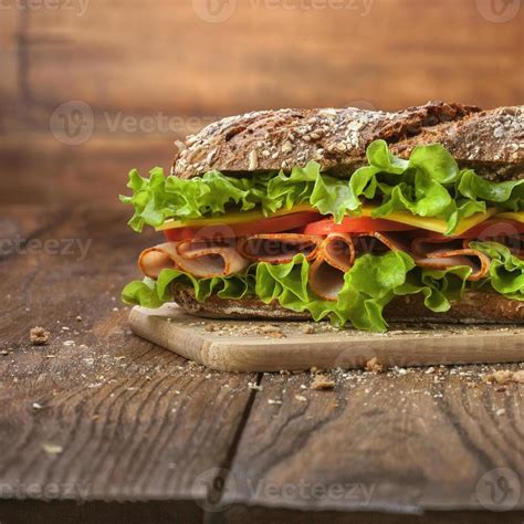 Sandwich on the wooden table 710576 Stock Photo at Vecteezy