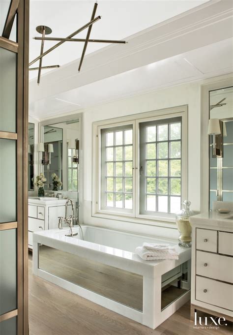 Modern White Master Bathroom with Mirror-Paneled Tub - Luxe Interiors ...