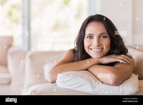 Pretty Brunette Relaxing On The Couch Stock Photo Alamy