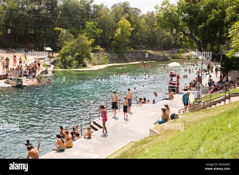 People Swim In The Outdoor Swimming Pool At Barton Springs Pool In