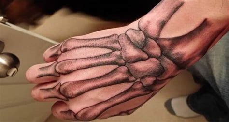 50 Incredible Skeleton Hand Tattoo Designs with Meaning 2024