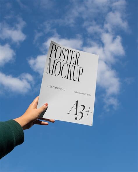 Premium Psd Holding A3 Poster Mockup In The Sky