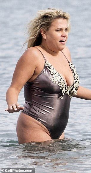 Lady Nadia Essex Wears Plunging Metallic Thong Swimsuit In Malaga