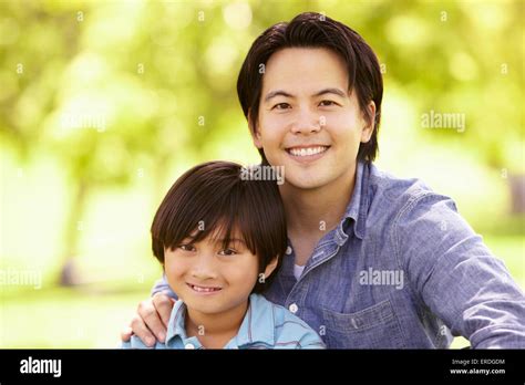 filipino father son hugging sitting  res stock photography  images