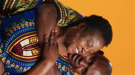 Vertical Video Loving Husband Embracing His Wife In Front Of Camera