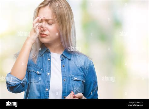 Young Blonde Woman Over Isolated Background Smelling Something Stinky