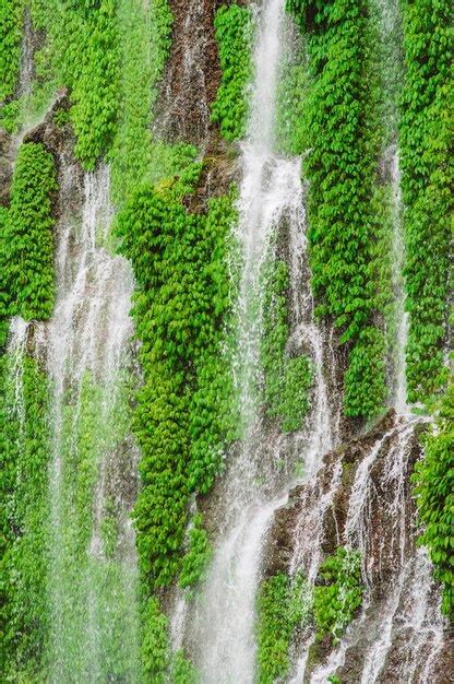 Premium Photo Water Flowing Through Rocks