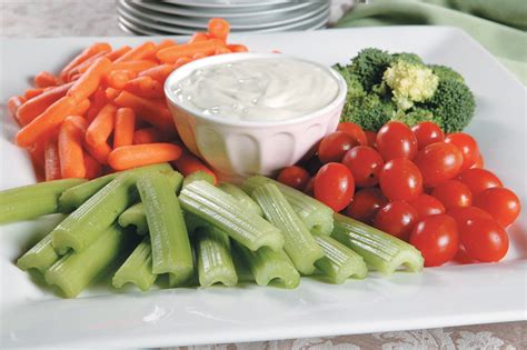 Vegetable Tray with Dip with Plates in Back - Prepared Food Photos, Inc.