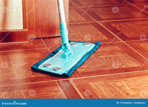 A Blue Floor Mop Stands On A Tile Floor Stock Image Image Of