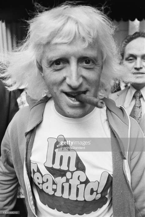 English Disc Jockey And Television Personality Jimmy Savile Wearing A