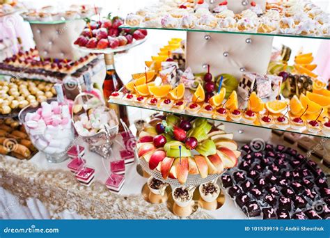 Variety of Sweet Desserts with Fruits and Alcohol Drinks on the ...