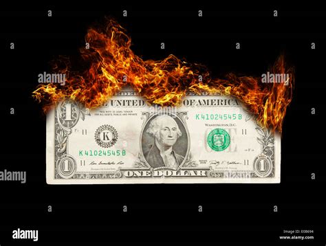 Burning Dollar Bill Symbolizing Careless Money Management And The